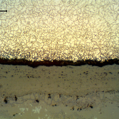 Micrography of the longitudinal section of the tube, close to the internal surface. 
A thick scale is evident, but no microstructural changes compared to the center of the tube.