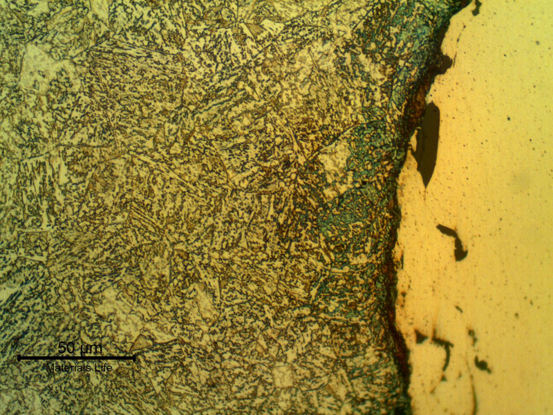 Micrographic detail of the interface between the shaft surface and the thermal spray layer. The shaft steel presents a quenched and (over) tempered structure. Longitudinal section.