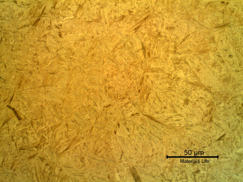 Micrographic detail of the shaft at the surface, in a region where a thermal spray layer was not applied.  The microstructure is martensitic (low carbon martensite) typical of a quenched and tempered condition for this low alloy steel.  The heat treatment was probably conducted before the thermal spray layer was applied.