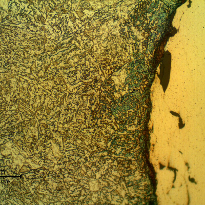 Micrographic detail of the interface between the shaft surface and the thermal spray layer. The shaft steel presents a quenched and (over) tempered structure. Longitudinal section.