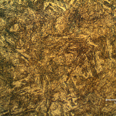 Micrographic detail of the tempered martensite structure close to the interface with the spray and fuse layer. Transverse section. The fuse is conducted in high temperature and the pin was heat treated after the thermal spray deposition and fuse.