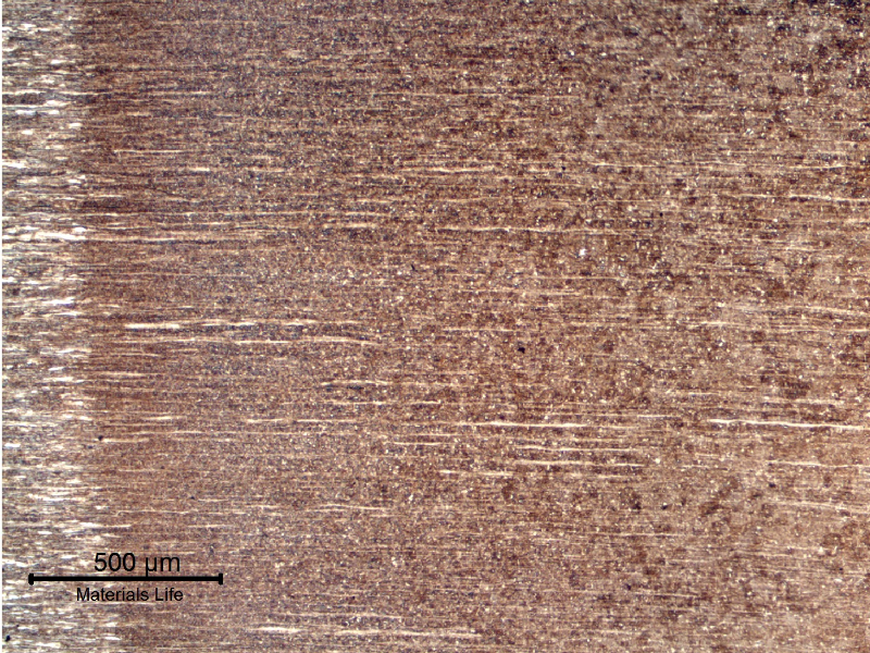Low magnification micrography of a longitudinal section of a 4 mm diameter wire, at the region where the pearlitic strain hardened wire is affected by the welding. The base metal is to the left side and the region of the HAZ that starts with a grain growth is to the right side.