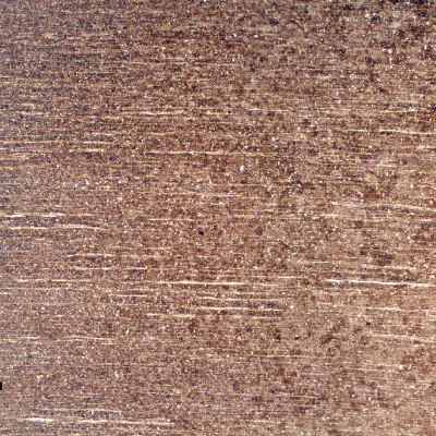 Low magnification micrography of a longitudinal section of a 4 mm diameter wire, at the region where the pearlitic strain hardened wire is affected by the welding.  The base metal is to the left side and the region of the HAZ that starts with a grain growth is to the right side.