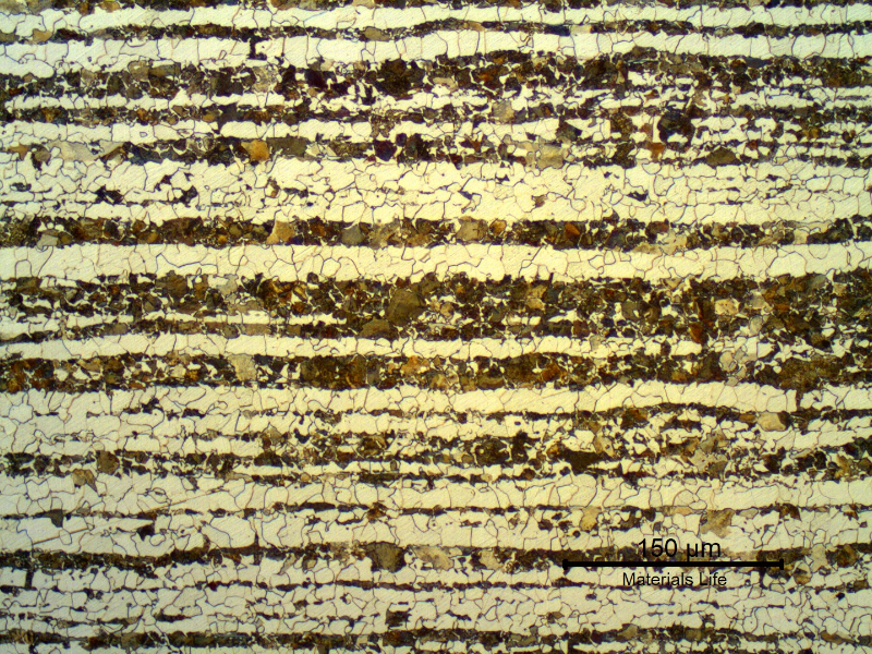 Micrography of a transverse section of the tubing, in the center of the thickness.
Ferritic-pearlitic structure. Bands of pearlite colonies. Refined grains.