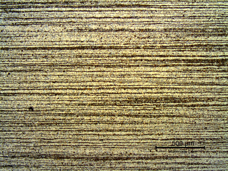 Low magnification micrography of a transverse section of the tubing, in the center of the thickness.  
Ferritic-pearlitic banded structure.