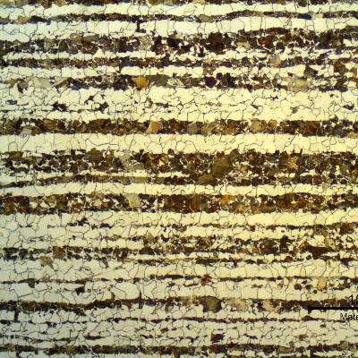 Micrography of a transverse section of the tubing, in the center of the thickness.  
Ferritic-pearlitic structure. Bands of pearlite colonies. Refined grains.