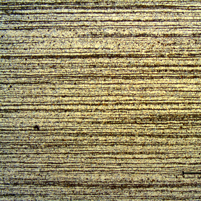Low magnification micrography of a transverse section of the tubing, in the center of the thickness.  
Ferritic-pearlitic banded structure.