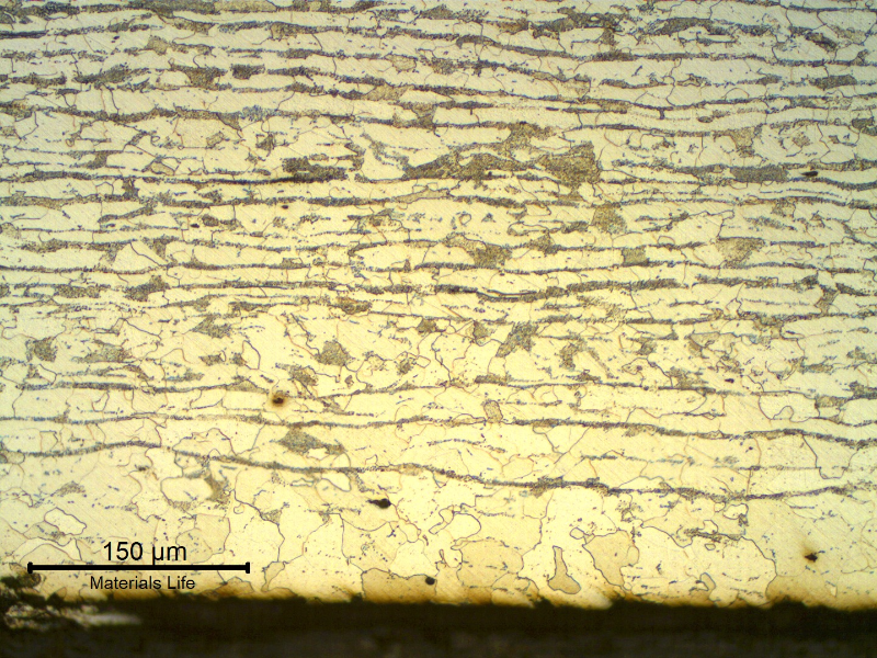 Micrographic detail of a transverse section of the tubing, close to the internal surface. Ferritic-pearlitic structure.  Very close to the surface the amount of ferrite is higher than in the center and the grain is coarser, due to a decarburization effect probably occurred when the surface was exposed to high temperature during manufacturing.