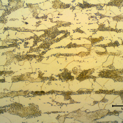 Micrographic detail of a transverse section of the 5 mm thick tubing, in the center of the thickness. Ferritic-pearlitic structure, with the pearlite presenting a coalesced aspect. The tubing was in service at ambient temperature, painted, and the coalesced aspect was generated before service, perhaps during the tubing manufacturing.