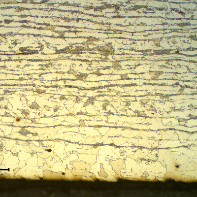 Micrographic detail of a transverse section of the tubing, close to the internal surface. Ferritic-pearlitic structure. Very close to the surface the amount of ferrite is higher than in the center and the grain is coarser, due to a decarburization effect probably occurred when the surface was exposed to high temperature during manufacturing.