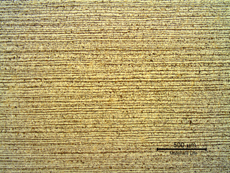 Low magnification micrography of a transverse section of the tubing, in the center of the thickness. Ferritic-pearlitic banded structure.