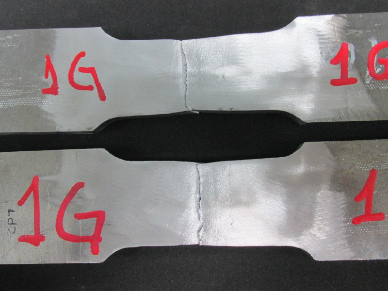 Tensile testpieces after testing. The rupture of the testpieces occurred at the margin of the weld.