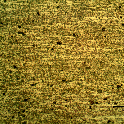 Micrographic detail of the aligned particles in the plate base metal.  The grain boundaries are not clearly identified in this higher magnification.