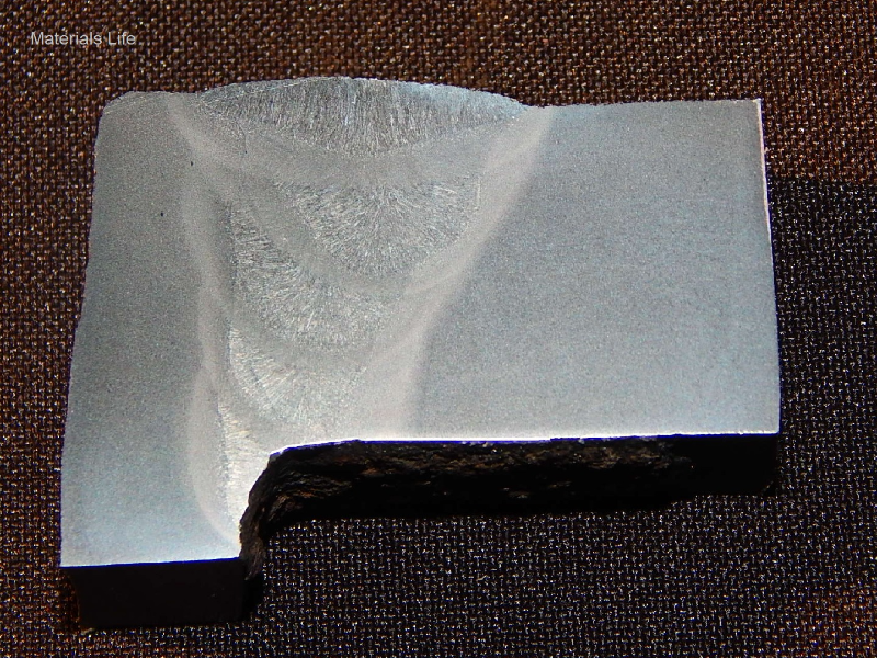 Macrography of the plate (thickness 22mm, in horizontal position) to tube (thickness 12.5 mm, in vertical position) welded joint. The half V groove was welded from the top (position inside the combustion chamber) in five weld beads, and with a small fillet welded from the water side (ouside of the tube). Average hardness of the plate is 180HV1 (1kg), of the tube is 150HV1 and of the weld is 190HV1. Maximum hardness of the tube HAZ is 165HV1 and plate HAZ is 195HV1.