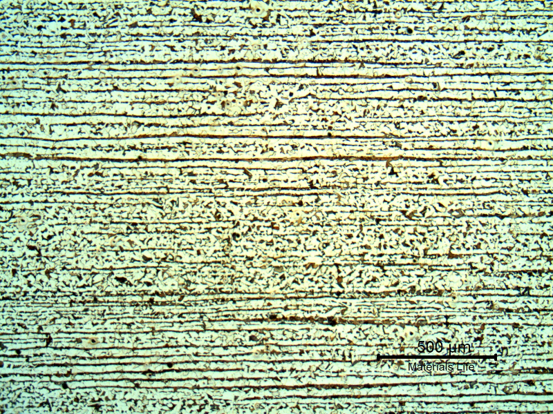 Micrography of the plate in a longitudinal section, presenting a typical ferritic pearlitic structure, banded.  The plate is 22 mm thick.