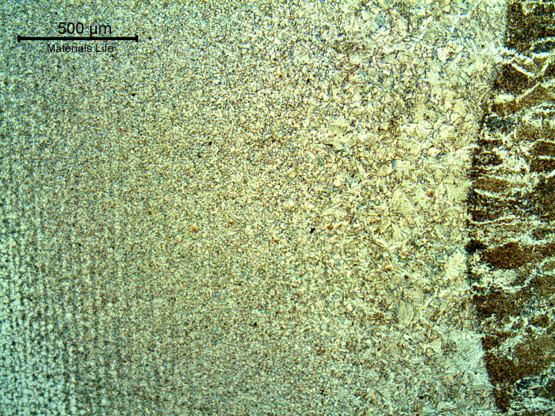 Low magnification micrography of the tube HAZ, at the fusion line. The weld metal is in the right side of the figure and the tube weld metal is in the left side of the figure.