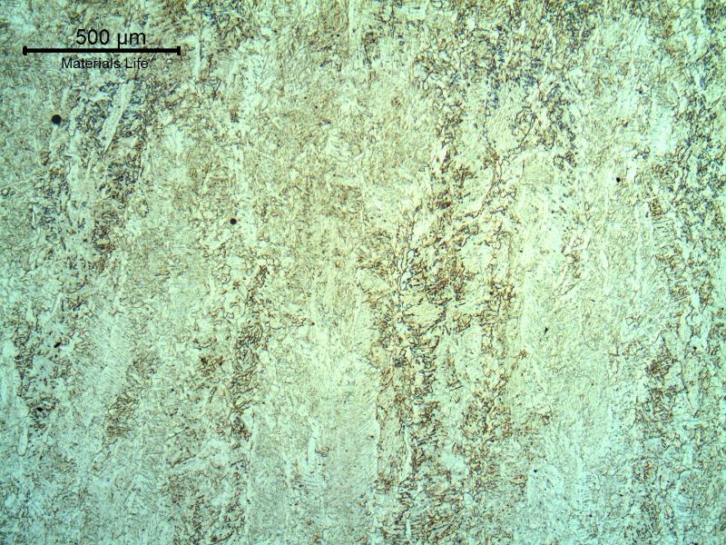 Micrography of the weld metal in the center os the weld. Columnar grains (of the previous austenite) with primary ferrite in the grain boundaries; ferrite with aligned second phases and acicular ferrite, intragranular.