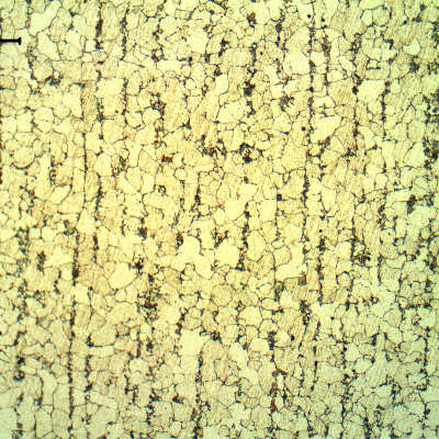 Micrography of the tube in a longitudinal section, presenting a typical ferritic pearlitic structure, banded.