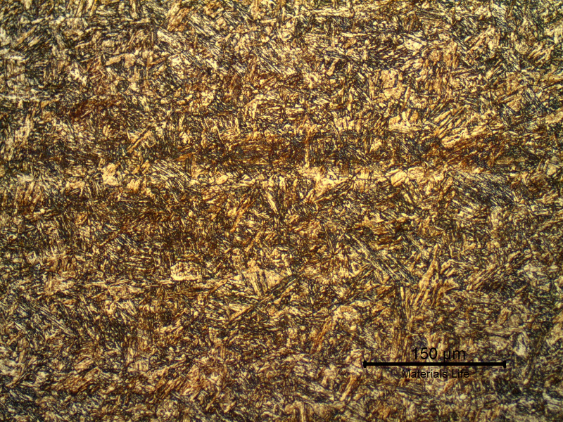17-4 PH rod. Micrography of the longitudinal section in the center of the thickness, presenting an aged martensitic structure. The darker lines are bands of (sligthly) segregated regions. This material presents properties that correspond to the H1150 grade.