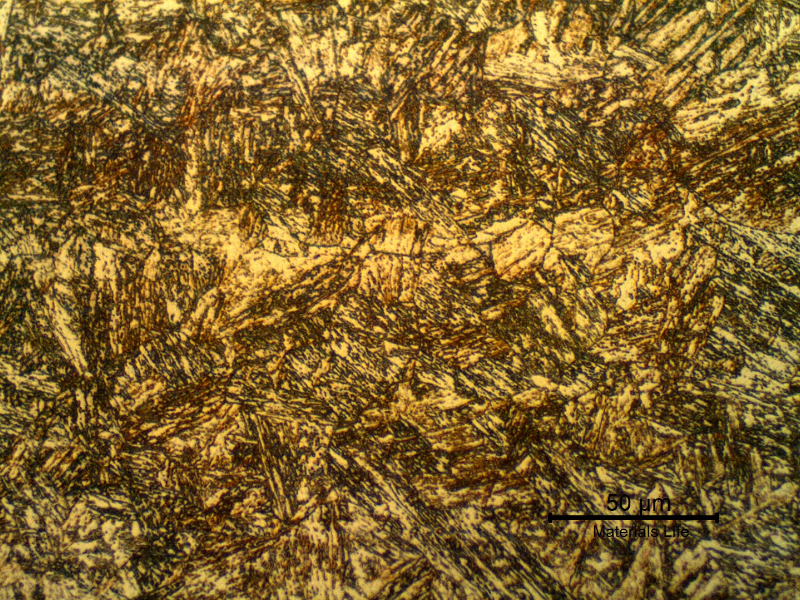17-4 PH rod. Micrographic detail of the aged martensitic structure. At this magnification level the previous austenite grain boundaries are evidenced. It is also possible to see that the bands of (sligthly) segregated regions are all martensitic.