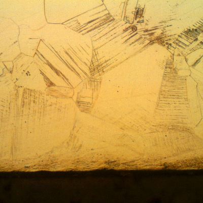 Nitronic 60 cylinder. Micrographic detail of the longitudinal section close to the surface, presenting a fully austenitic microstructure, with a layer of strain hardened structure (deformation twins).