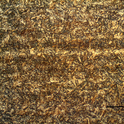 17-4 PH rod. Micrography of the longitudinal section in the center of the thickness, presenting an aged martensitic structure. The darker lines are bands of (sligthly) segregated regions. This material presents properties that correspond to the H1150 grade.