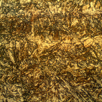 17-4 PH rod. Micrographic detail of the aged martensitic structure. At this magnification level the previous austenite grain boundaries are evidenced. It is also possible to see that the bands of (sligthly) segregated regions are all martensitic.