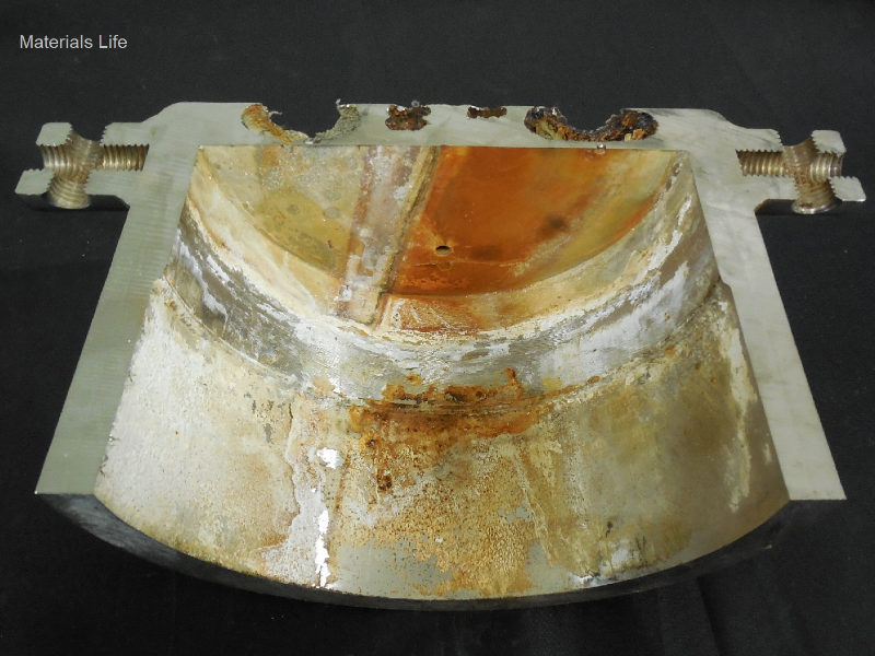 After a longitudinal cut of the case it was possible to see that a localized corrosion has occurred associated to the regions where there were sealed holes, plugged, in a crevice condition, not related to any welded position.