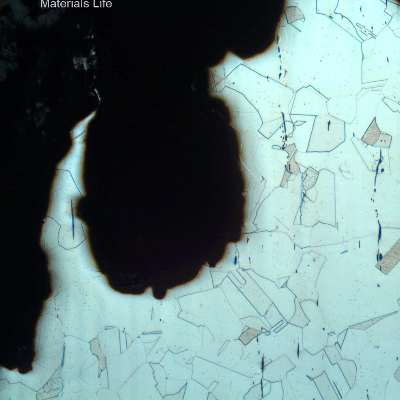 Micrographic detail of the crevice corrosion in the case wall, showing that the structure is not affected and is fully austenitic with equiaxial grains typical of a solution annealed condition.