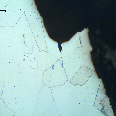 Micrographic detail of the crevice corrosion in the case wall, showing that the structure is not affected and is fully austenitic with equiaxial grains typical of a solution annealed condition.  Even non metallic inclusions did not accelerate corrosion since the extension of the inclusions was not too long and they were not connecting to others.