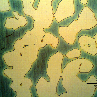 Micrographic detail of the ferrite and austenite structure in the transverse section of the forged bar, in the center of the thickness.