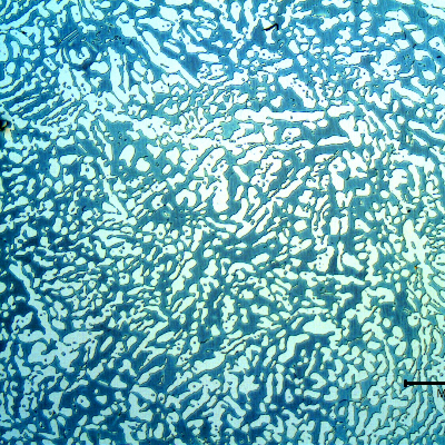 Micrography of a transverse section of the forged bar in the center of the thickness. Ferrite and austenite.  Coarse structure.