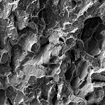 Fractography of the broken Charpy V testpiece,  longitudinal, broken at -46°C and presenting energy of 64J (the average of three values was 70J).  In this direction the material presented an energy value higher than the minimum requirement of 45J.