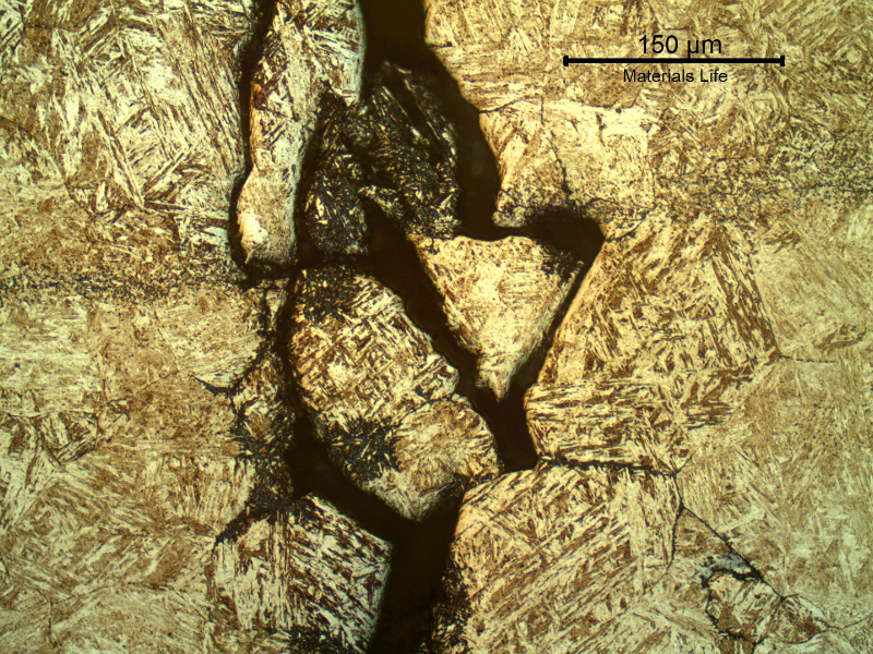 Micrography of a transverse section of the ring at the cracking position. The cracks are intergranular and opened at the position close to the surface. it is possible to identify dissolution of the structure adjacent to the grain boundaries,