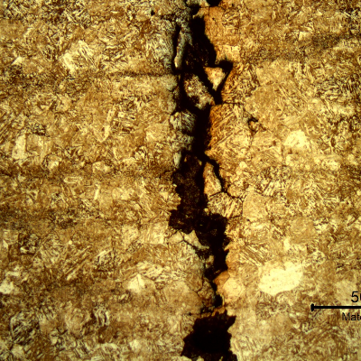 Micrography of a transverse section of the ring at the cracking position.  The cracks are intergranular and opened at the position close to the surface.