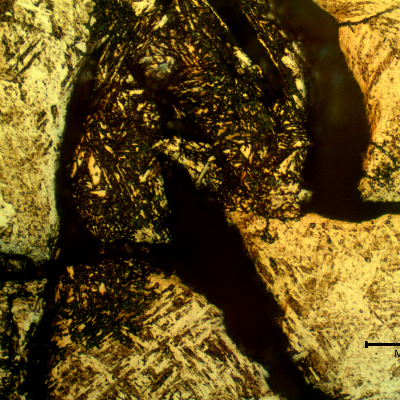 Micrographic detail of a transverse section of the ring at the cracking position.  The cracks are intergranular and opened at the position close to the surface. it is possible to identify dissolution of the structure adjacent to the grain boundaries,