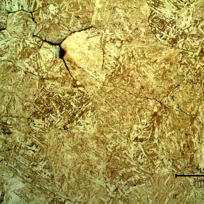 Micrography of a transverse section of the ring, in the center, where the cracking was closed.  The cracks are intergranular and not opened to the surface.