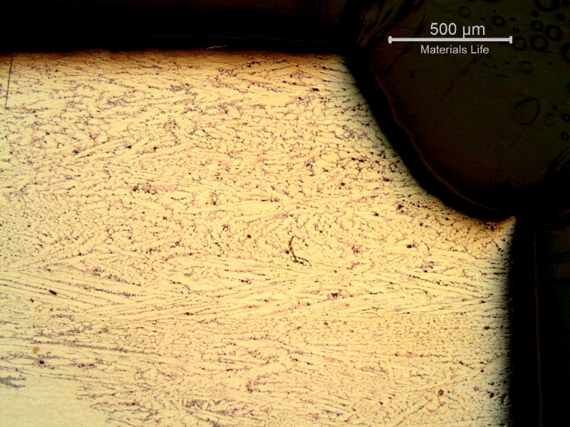 Micrography of the transverse section of the platesheet showing that part of the material (right side in the top of the figure) was lost (corroded).