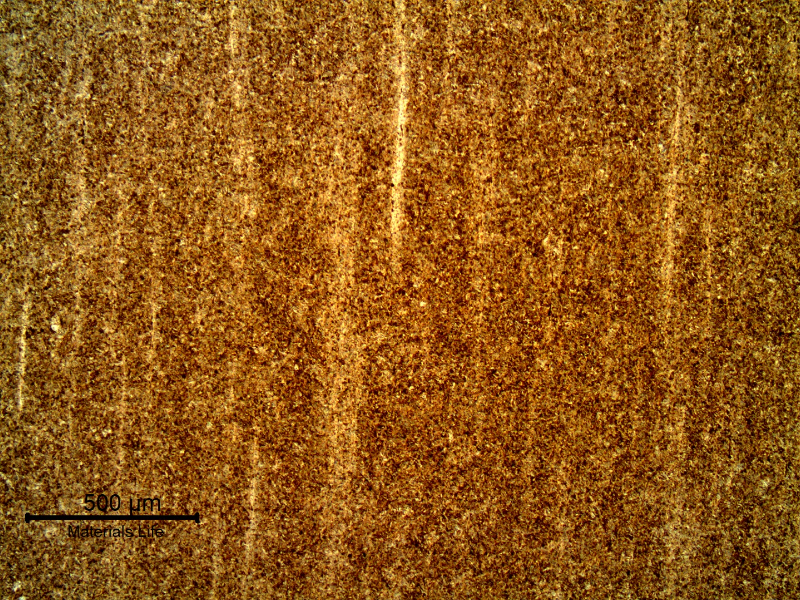 Micrography of the longitudinal section of the bolt showing a martensitic structure, with segregation bands evidenced by the chemical etch.