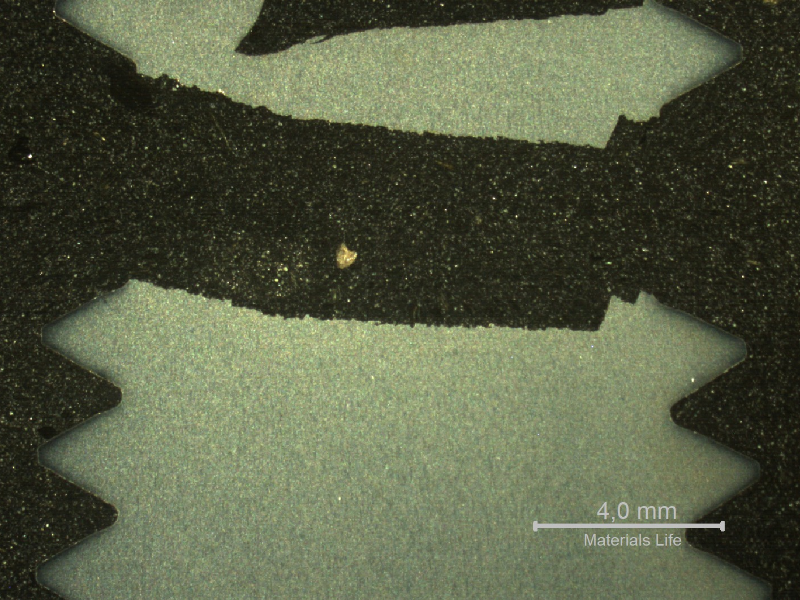 Macrography of a longitudinal section of the stud, showing the flat fracture of brittle aspect.