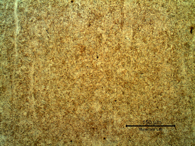 Micrography of the longitudinal section of the stud presenting a tempered martensite structure, slightly banded. 
Hardness 45 HRc.
