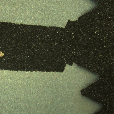 Macrography of a longitudinal section of the stud, showing the flat fracture of brittle aspect.
