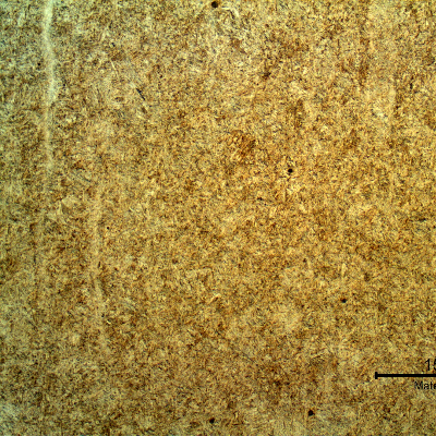 Micrography of the longitudinal section of the stud presenting a tempered martensite structure, slightly banded. 
Hardness 45 HRc.