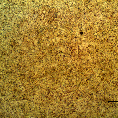 Micrography of the longitudinal section of the stud presenting a tempered martensite structure in the center of the thickness.