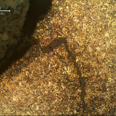 Micrography of the longitudinal section of the stud showing a crack from the thread fillet, of a ductile aspect, opened during torque.