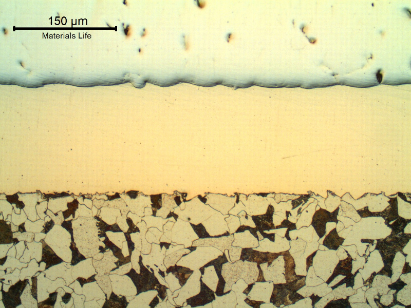 Micrography of the longitudinal section of the cylinder , at the surface, where it was not yet damaged. The steel substrate is in the bottom of the figure, the Ni layer is in the center and the Cr layer is in the top of the figure.