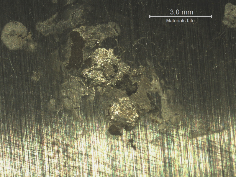 Detail of a localized dissolution at the surface of the chromium plated cylinder. Note the dimension of the corrosion pitting, shallow.