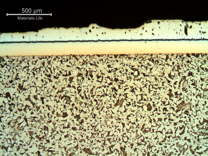 Micrographic aspect, after Nital etching, of the longitudinal section of the cylinder, at the surface, in a region where the damage is in the begining.  There are two layers at the surface.  A first Ni layer, 160 microns thick and 300HV average hardness, over the low carbon steel substrate, 200HV average hardness, and a chromium plated layer, 250 microns thick and 1100HV average hardness.