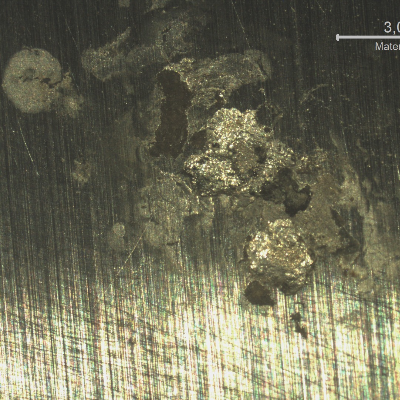 Detail of a localized dissolution at the surface of the chromium plated cylinder. Note the dimension of the corrosion pitting, shallow.