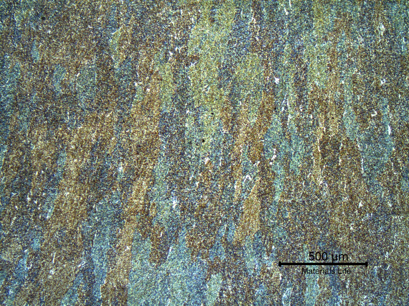Micrography of the weld metal at the face of the joint. It is possible to see the columnar grains of acicular ferritic structure.  The hardness level of this region varied a little.  From 231HV10 at the root until 250HV10 close to the face.